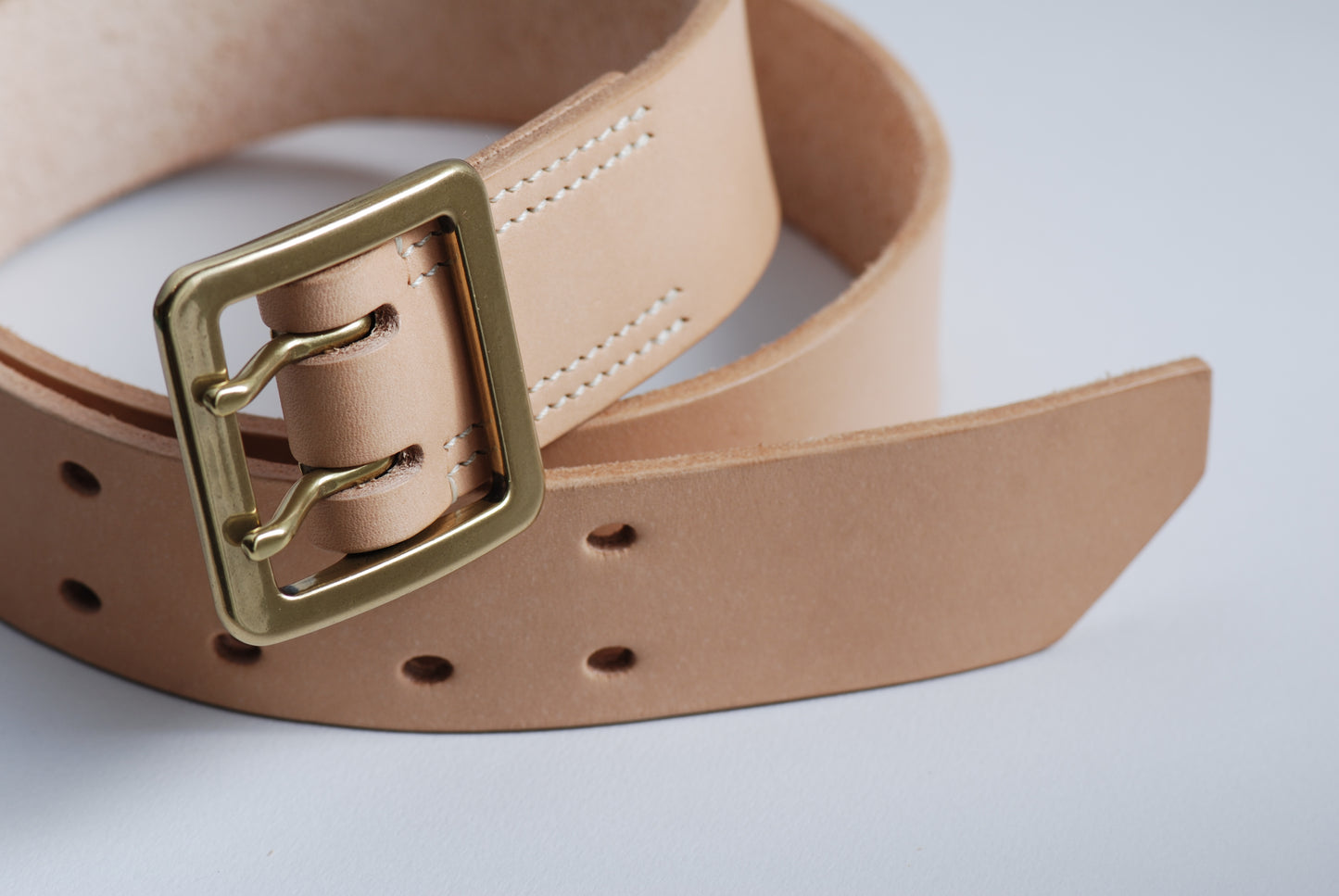 The Worker full grain Tochigi Leather belt showing solid brass double prong buckle and oval holes with tip design - Hunterwood NZ