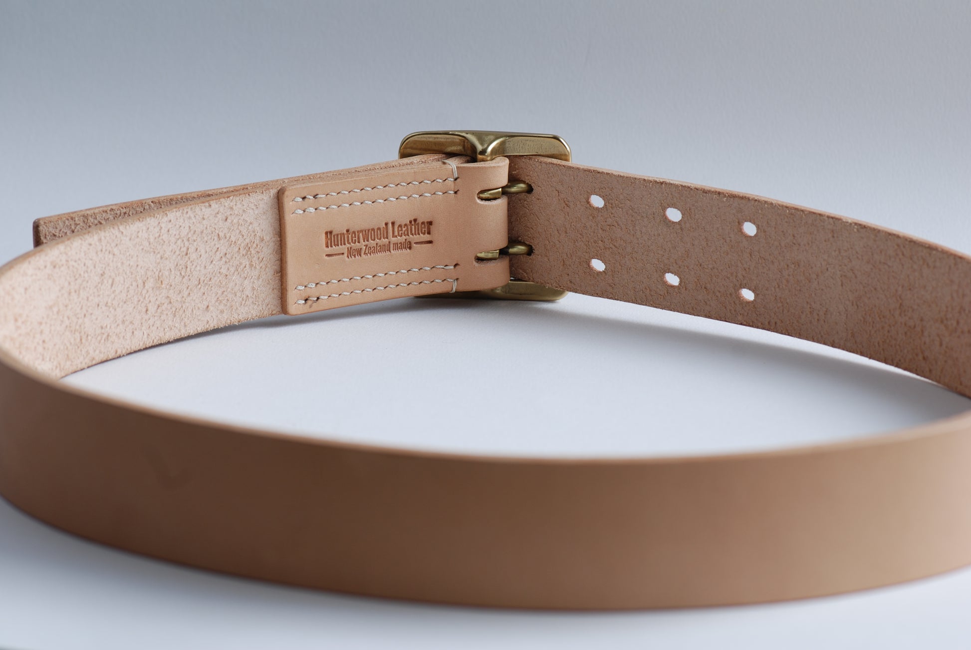 The Worker full grain Tochigi Leather belt showing back logo and saddle stitching - Hunterwood NZ